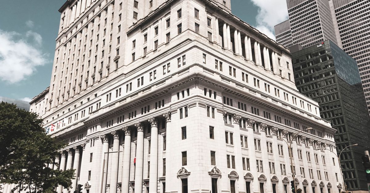 Elegant architectural structure in downtown Montreal, showcasing classic urban design.