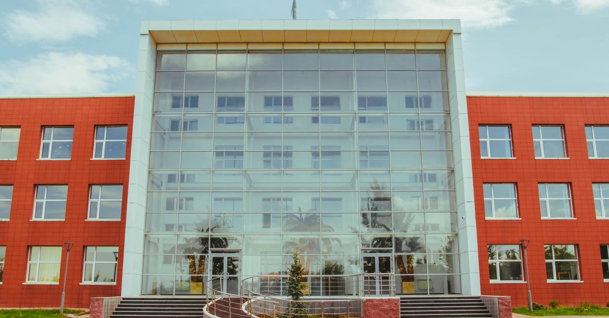 Front view of a modern glass facade building located in Ust'-Kamenogorsk, Kazakhstan.