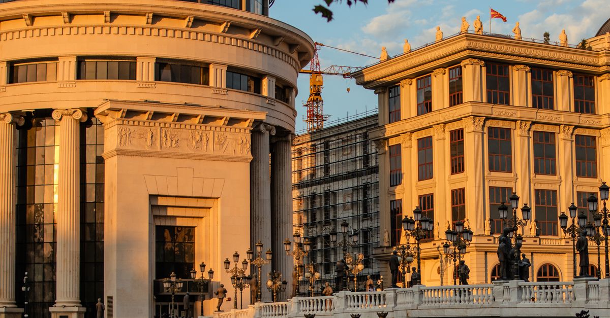 A stunning view of architectural buildings bathed in sunlight in Skopje, North Macedonia.