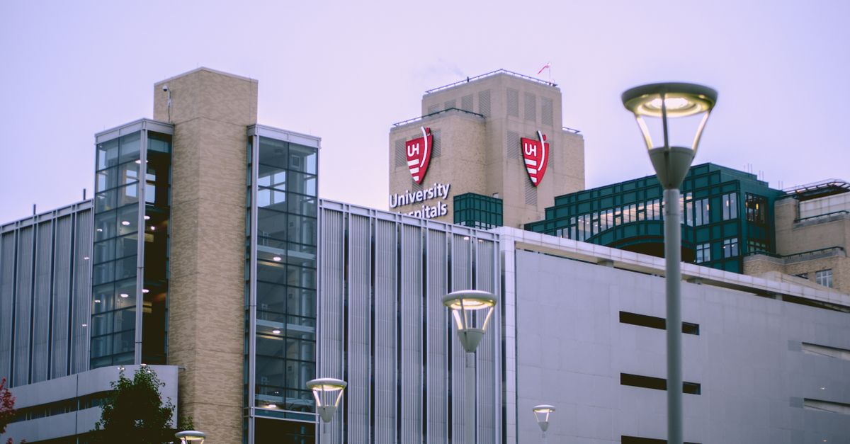 View of University Hospitals building in Cleveland, OH against a clear sky.
