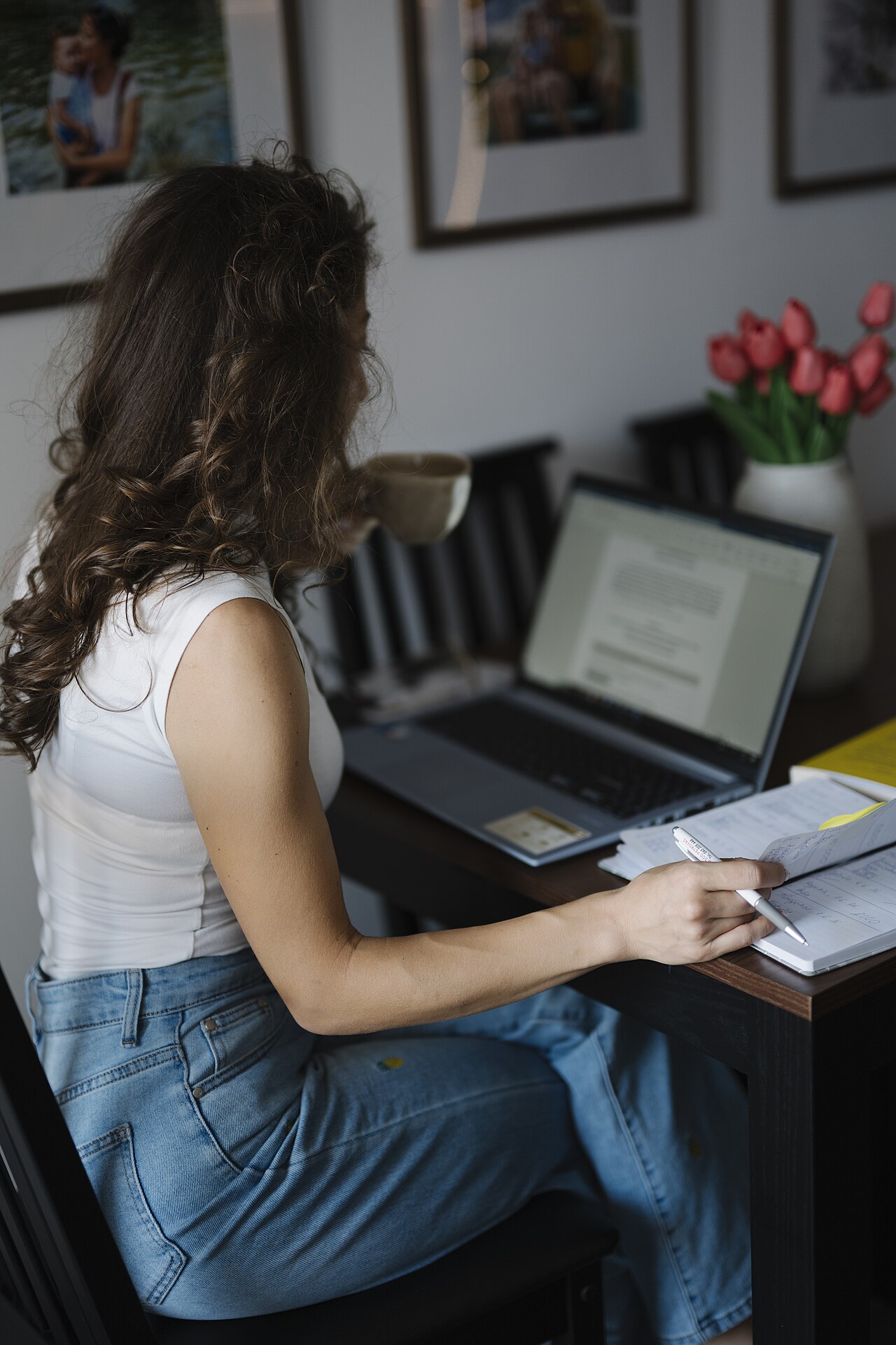 A person looking something up on a laptop