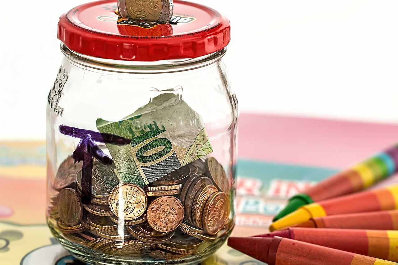 A piggy bank with a coin